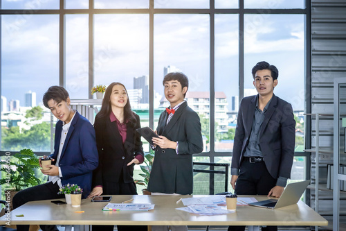 Successful happy workers Group of asian business people with diverse genders (LGBT) workers with in company workers Group of asian business people and support in the meeting room at office