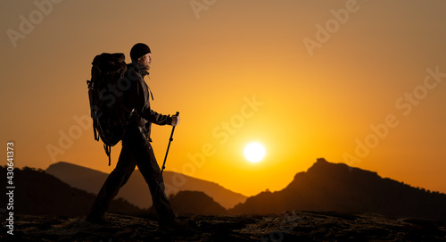 tourist - backpacker with backpack and bkack touristic equipment photo