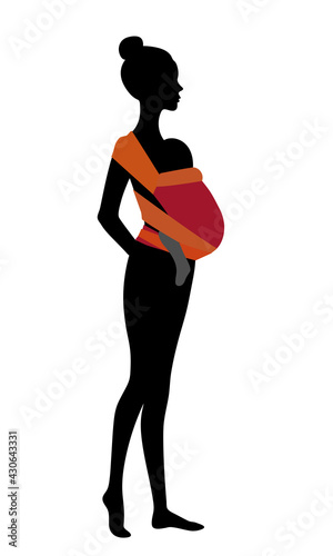 Woman silhouette with a baby in a red mei-tai sling. Babywearing mother concept