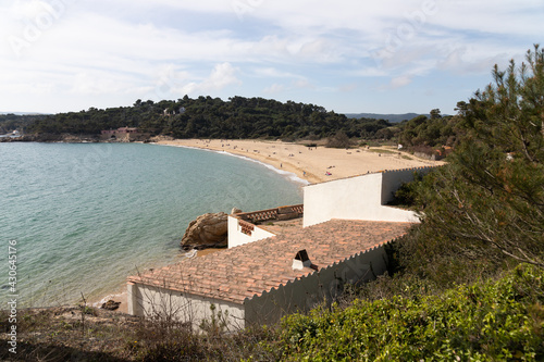 Landscape of a beach in Spain, mediterranean sea and coastal vegetation.. Relaxing on the beach