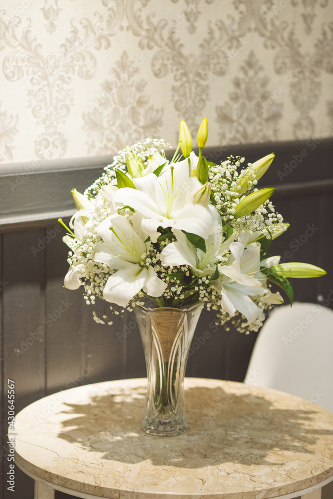 cake table decorated with flowers for wedding