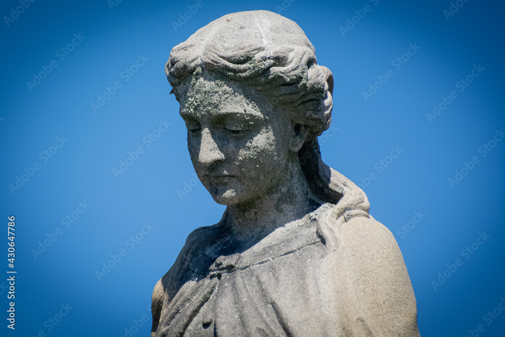 Statue in abandoned cemetery 