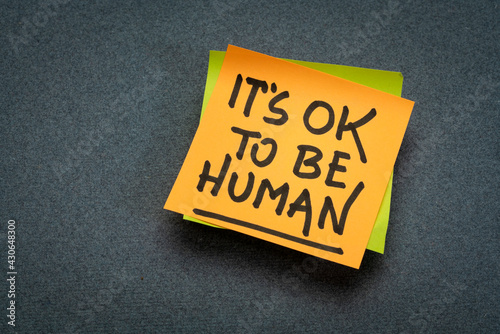 it is OK to be human - inspirational reminder note, emotions, vulnerability and personal development concept photo