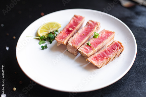 tuna grilled seafood fried barbecue fish second course meal snack  keto or paleo  pescetarian diet vegetarian food copy space food background rustic. top view