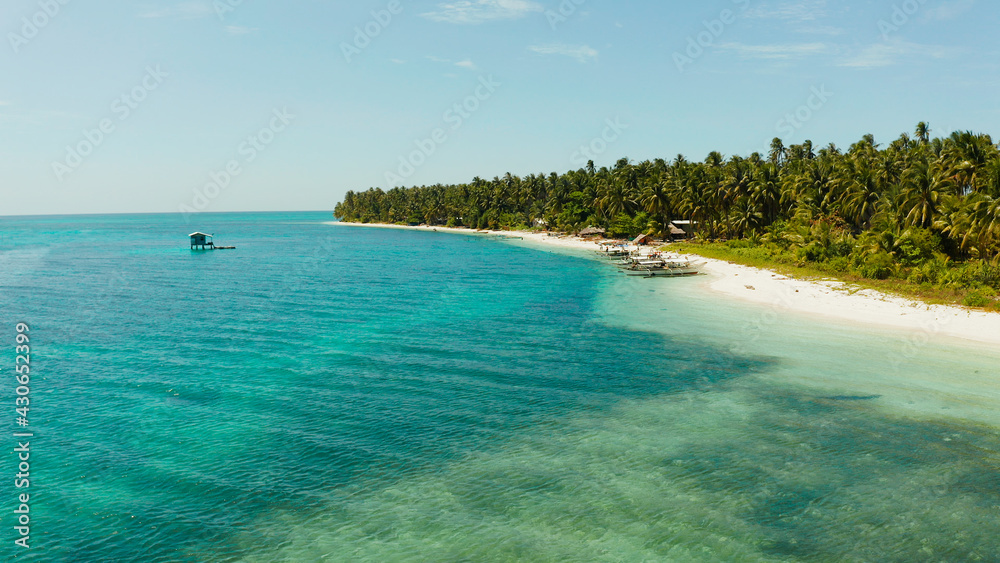 Tropical landscape: small island with beautiful beach, palm trees by turquoise water view from above. Patongong Island with sandy beach. Summer and travel vacation concept. Tropical landscape: small island with beautiful beach, palm trees by turquoise water view from above. Patongong Island with sandy beach. Summer and travel vacation concept.