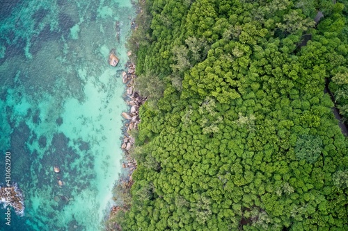 Wallpaper Mural Drone field of view of rocky coastline and cliffs meeting sea Praslin, Seychelles. Torontodigital.ca