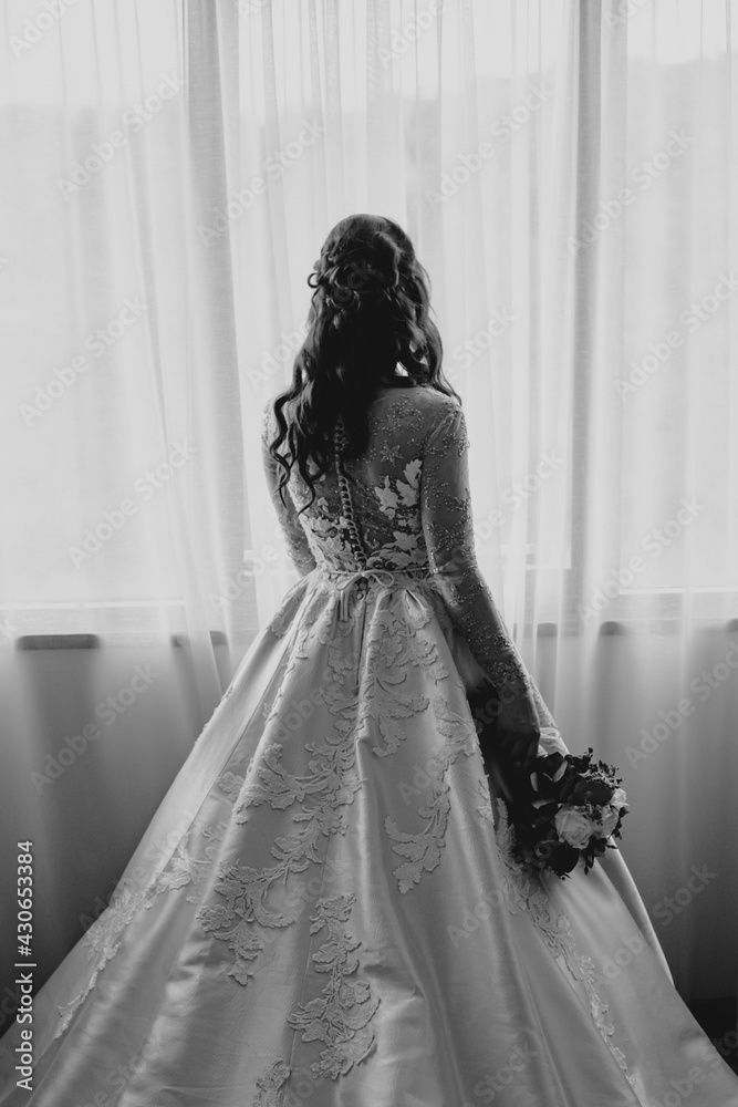 Fototapeta premium bride and groom holding hands wedding day ring bouquet with flowers in white wedding dress 
