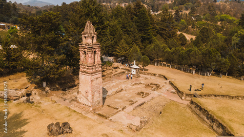 Aerial photo of an old church tower, in the municipality of Tlalpujahua, Michoacan, Mexico, only the vestiges of it remain. photo