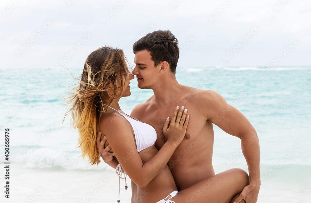 Beautiful smiling couple hugging and going to kiss. Beautiful smiling couple hugging and going to kiss.