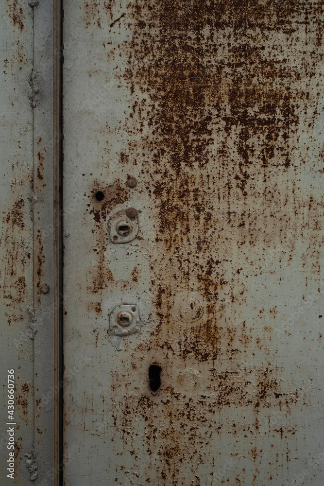 Rusty metal door texture, keyhole close up Rusty metal door texture, keyhole close up