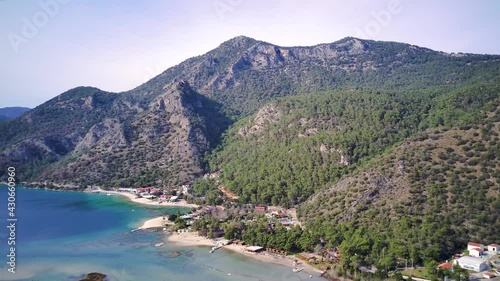 Amazing high angle top drone view on world famous paragliding and parasailing turkish spot for extrim parachute sport in Oludeniz in Fethiye, Turkey
