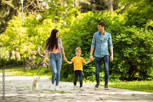 Happy family with cute bich...