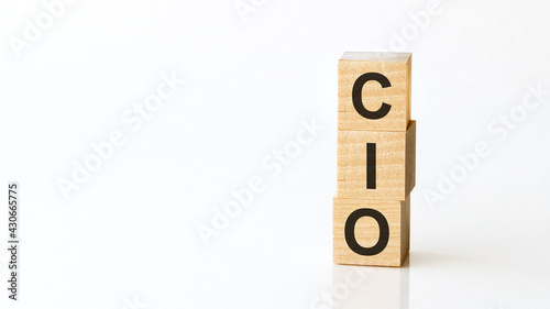 cio - acronym from wooden blocks with letters, chief information officer, white background