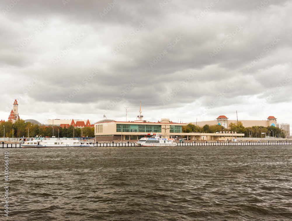Moscow, Russia, Sep 14, 2019: Motor ship sails on the  Moscow river. Southern river station. Pre-storm weather. Dark clouds