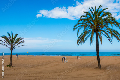 Landscape of Gandia Beach, with some people on the sand.