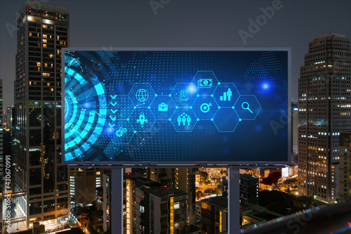 Research and technological development glowing icons on billboard. Night panoramic city view of Bangkok. Concept of innovative activities expanding new services or products in Southeast Asia.