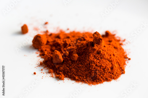 close up of red paprika over white 