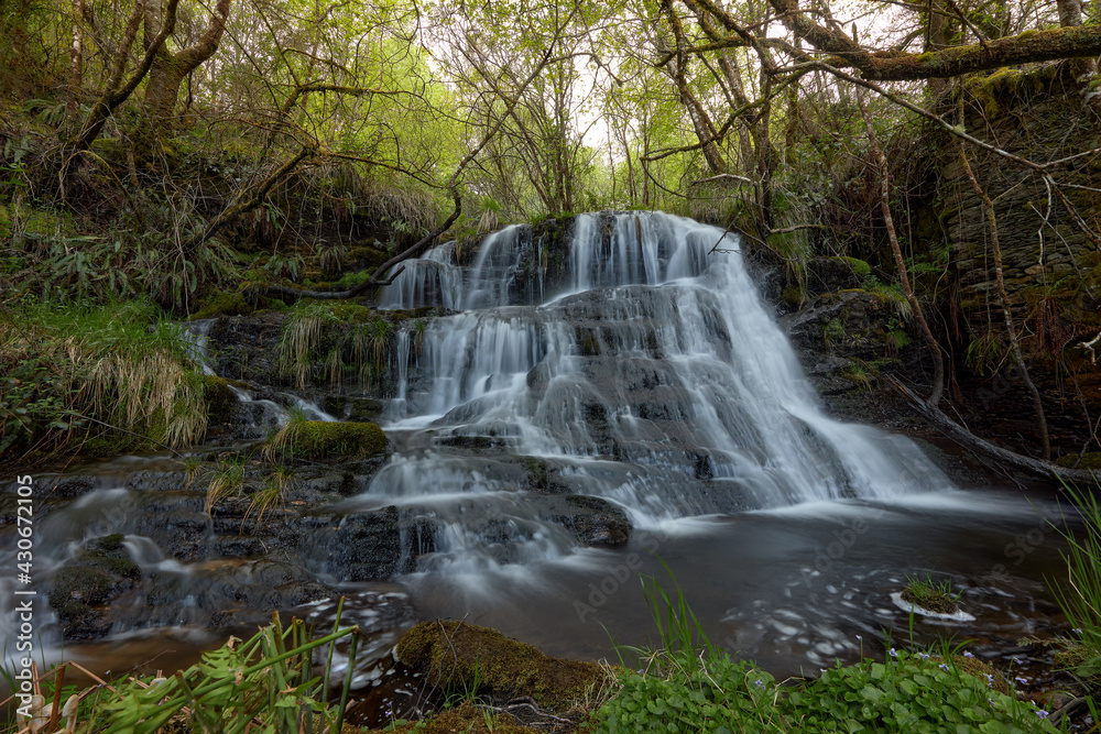 Waterfall in a beautiful forest in the area of Galicia, Spain. Waterfall in a beautiful forest in the area of Galicia, Spain.