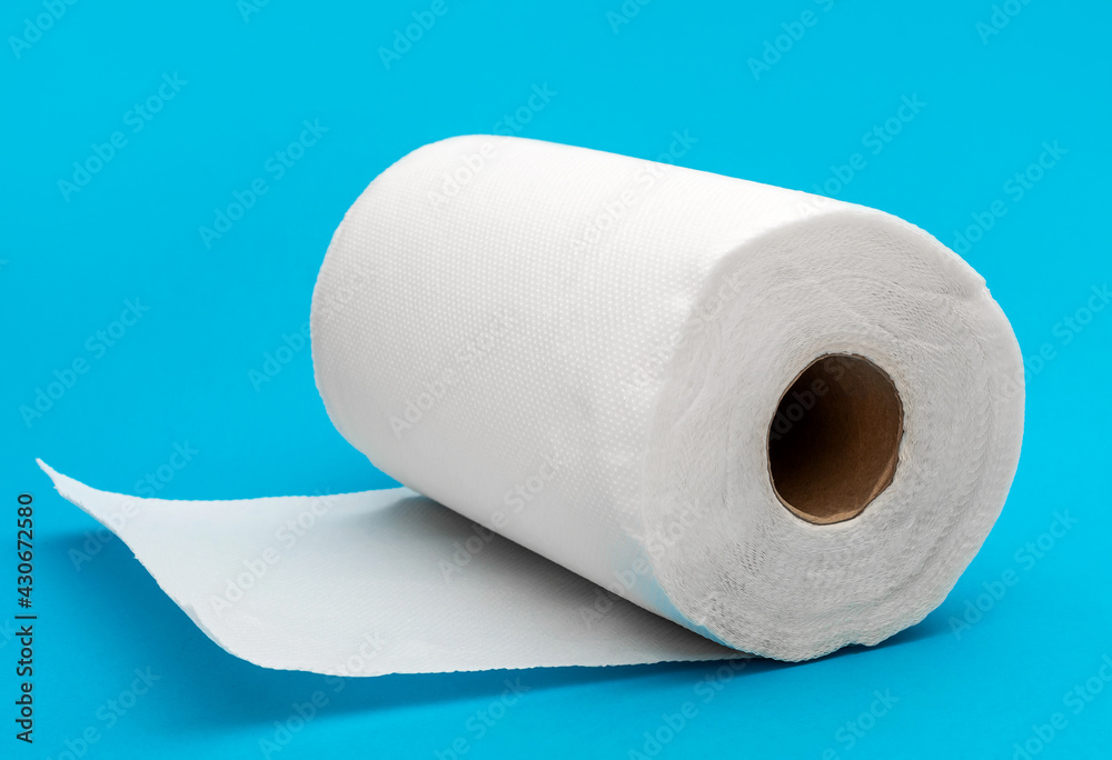 Fototapeta premium Kitchen Paper towel on blue background.