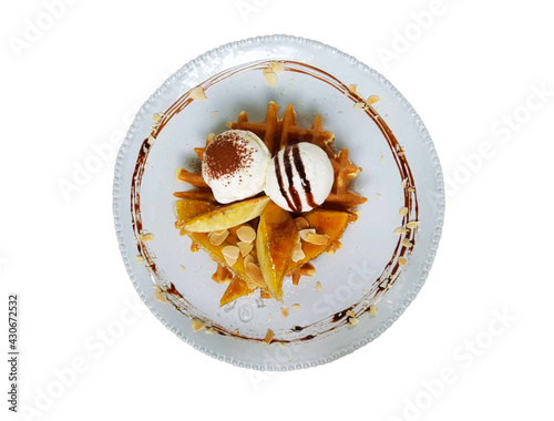 Waffle with ice cream on top.