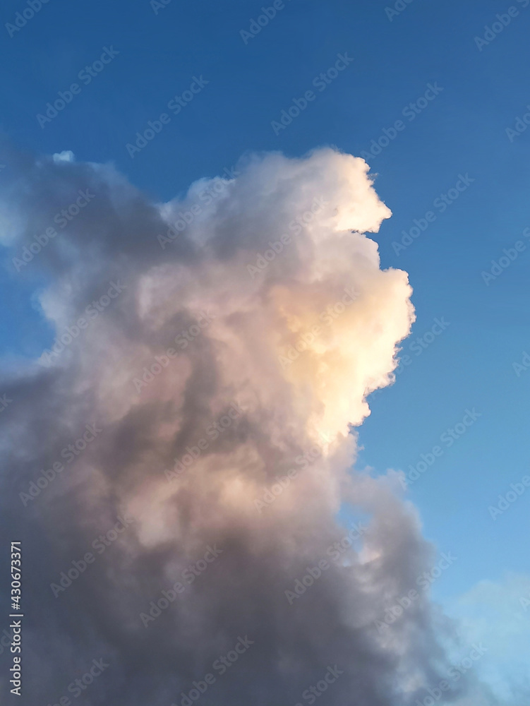 dramatic cloud in blue sky with pink skylight on top