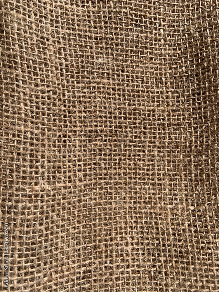 Closeup view of rustic Burlap showing texture and details. Burlap textured background. Closeup view of rustic Burlap showing texture and details. Burlap textured background.