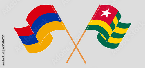 Crossed and waving flags of Armenia and Togo