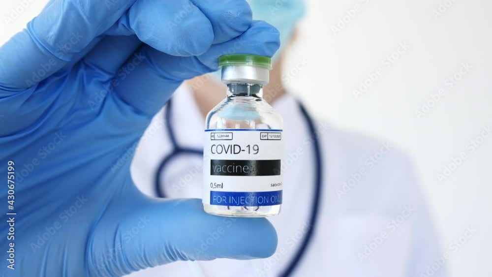 COVID-19 Vaccine in Researcher Hands, Doctor's Hand Holds a Vaccine Ampoule at the Hospital. New Medication Developing, Vaccination. Prevention of flu. High quality 4k footage COVID-19 Vaccine in Researcher Hands, Doctor's Hand Holds a Vaccine Ampoule at the Hospital. New Medication Developing, Vaccination. Prevention of flu. High quality 4k footage