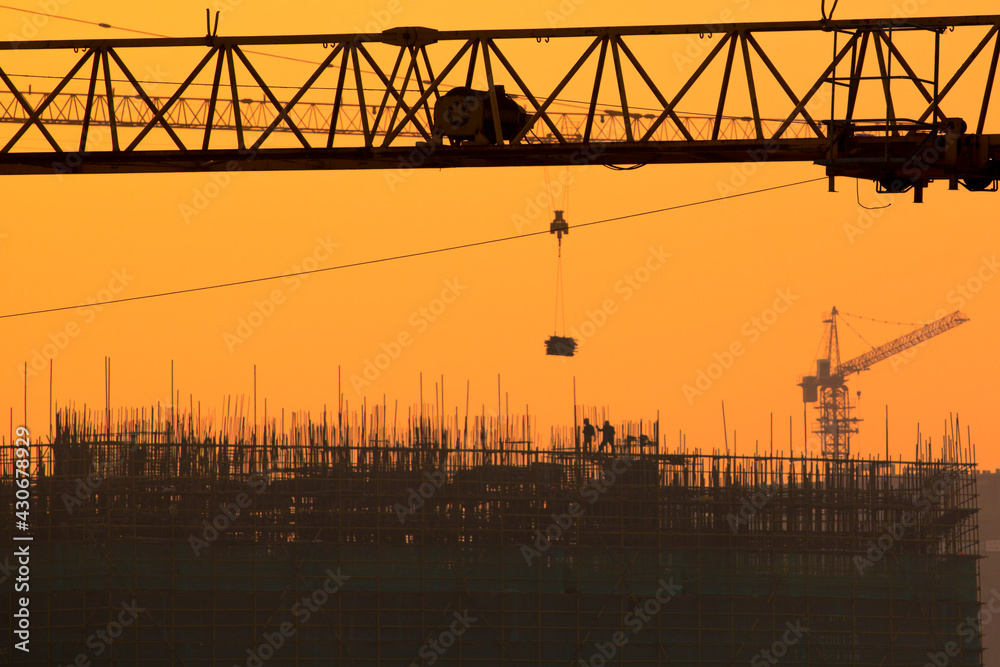 Sunset on a construction Site in Shanghai, the city is growing day after day with a population of over 20 millions people