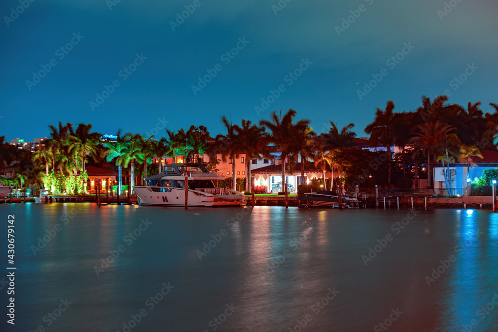 Miami skyscrapers at the night, yacht or boat next to Miami downtown, night view, south beach. Miami skyscrapers at the night, yacht or boat next to Miami downtown, night view, south beach.