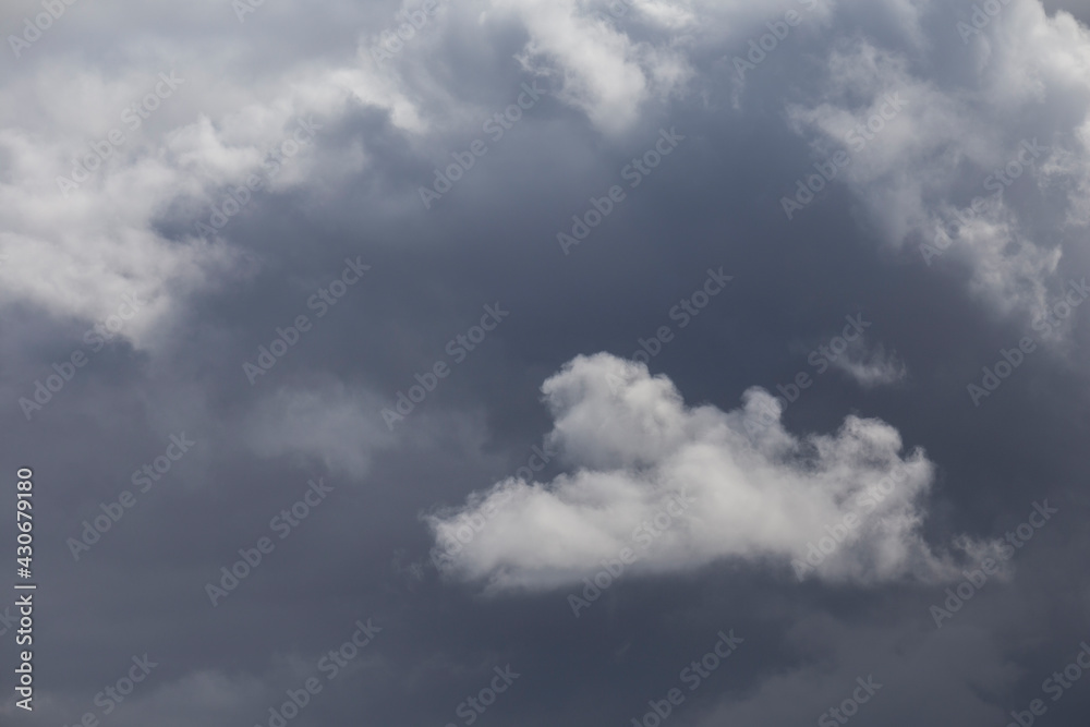 Cloudy dark blue sky abstract background in a stormy day.