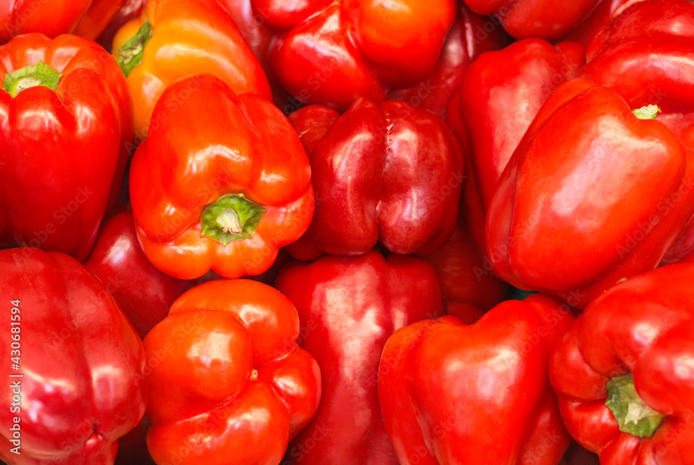 Pile of paprika peppers background, closeup marketplace. Red bell peppers background. Pile of paprika peppers background, closeup marketplace. Red bell peppers background.