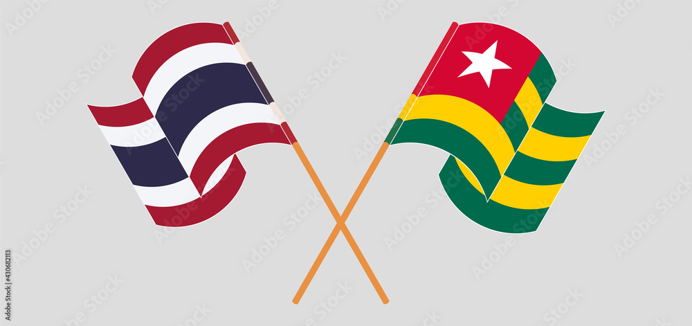 Crossed and waving flags of Thailand and Togo Crossed and waving flags of Thailand and Togo