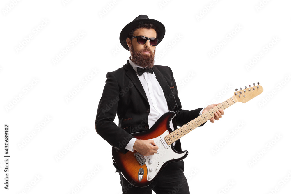 Bearded male guitarist in a suit Bearded male guitarist in a suit