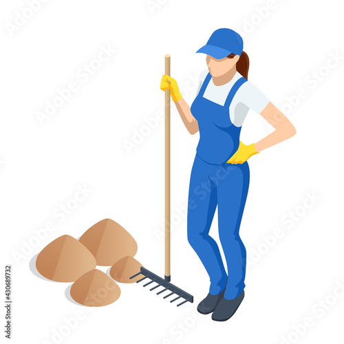 Agricultural work. Woman working in garden with rake leveling ground. Soil preparation for seeding and planting, garden tools, gardening, rake, soil, outdoor work concept.