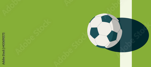 soccer ball standing near the center line on the green field