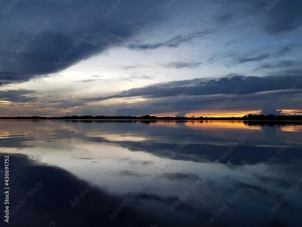 Impressive sunset over Mamori Lake, Amazon – Brazil