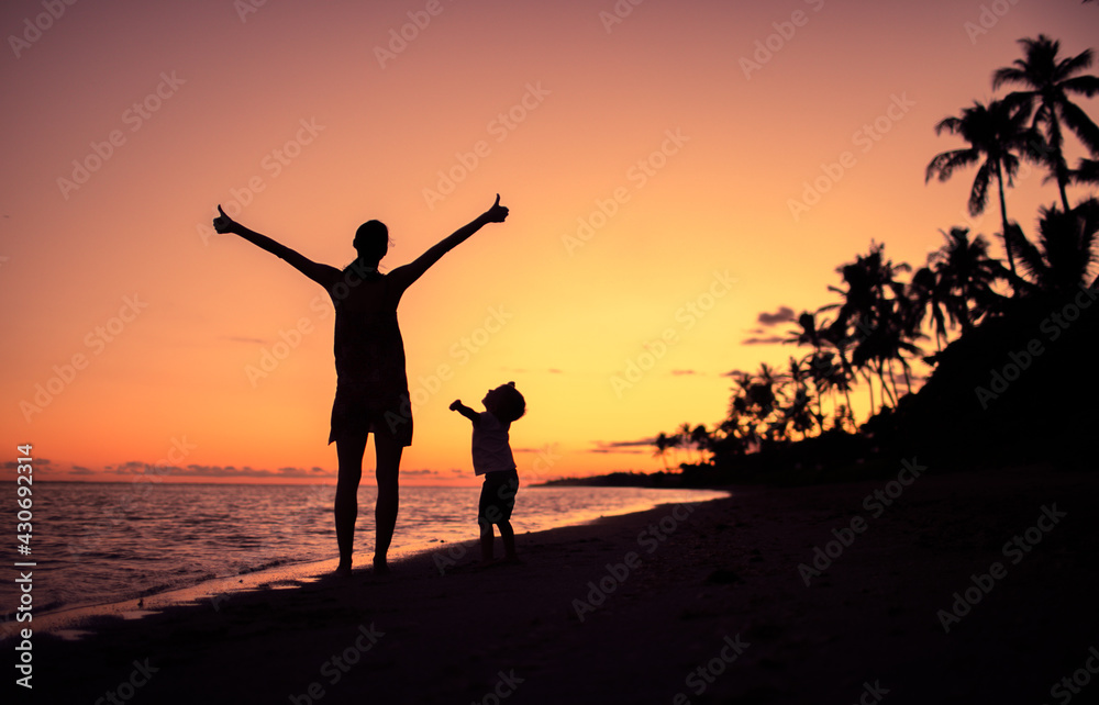 Happy mother and child together on the beach. 