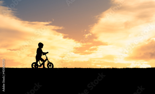 little boy riding his bicycle 