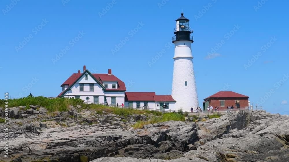 Portland Head Lighthouse and keepers house in summer, Cape Elizabeth, Maine ME, USA. Portland Head Lighthouse and keepers house in summer, Cape Elizabeth, Maine ME, USA.