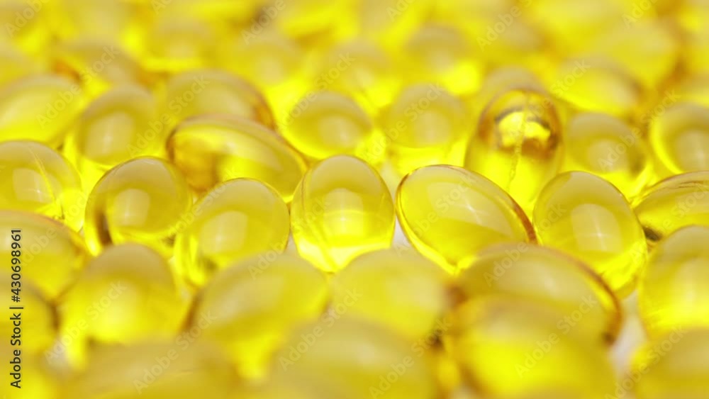 colorful nutritional diet supplement vitamin pills capsules on a white background (looping) colorful nutritional diet supplement vitamin pills capsules on a white background (looping)