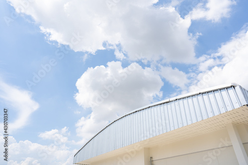 Curved metal roof, zinc color Sky background