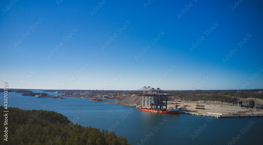 Stockholm Norvik Port, Sweden, 2020-03-18: Aerial view of installing new cranes, shipped from China to Sweden. High quality photo
