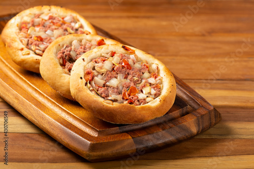 Arabic meat sfiha on the table.