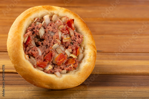 Arabic meat sfiha on the table.