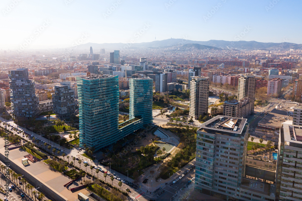 Aerial panoramic view of Barcelona modern neighborhood of Diagonal Mar i el Front Maritim del Poblenou on Mediterranean coast, Spain..
