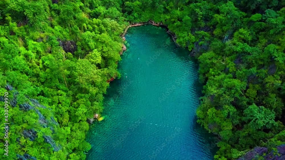 Aerial of tourists swimming in cove of Kayangan Lake, Coron, Palawan. Aerial of tourists swimming in cove of Kayangan Lake, Coron, Palawan.