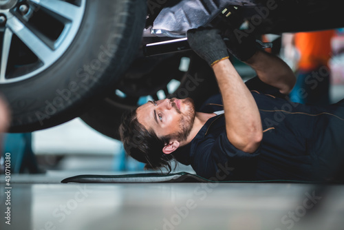 mechanic car service worker man technician are maintenance or repair vehicle car engine in garage shop , workshop work with auto inspection automobile station, job of repairman
