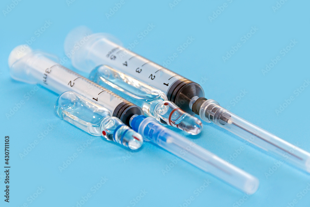 Vaccine. Medical ampoules and syringe for injection. Vaccine. Medical ampoules and syringe for injection.