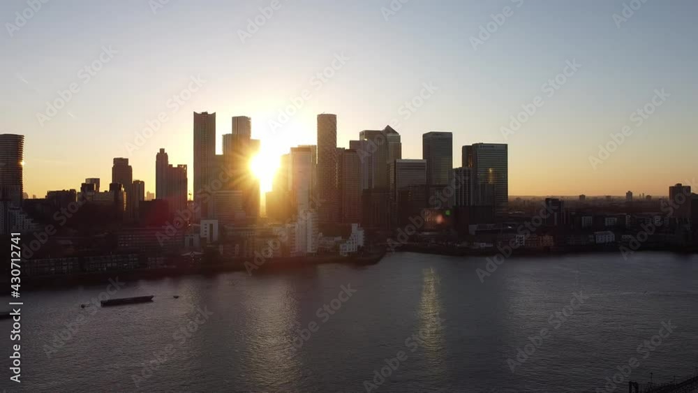 Aerial - Sunset over River Thames and Canary Wharf, London, scenic pan right Aerial - Sunset over River Thames and Canary Wharf, London, scenic pan right